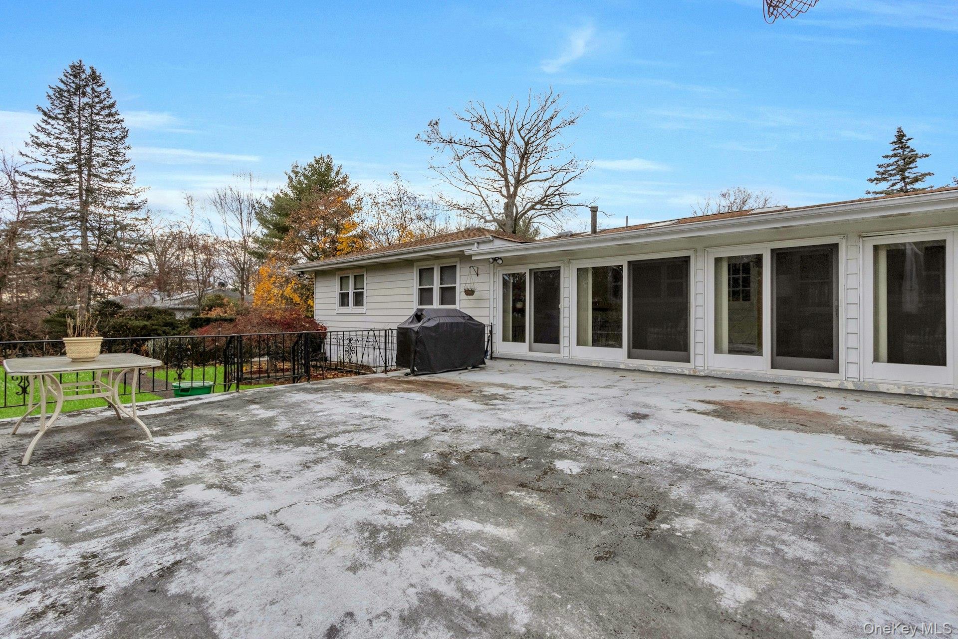 44 Greenridge Way Spring Valley, NY 10977 - Photo 45 of 46 a front view of house with yard and trees in the background