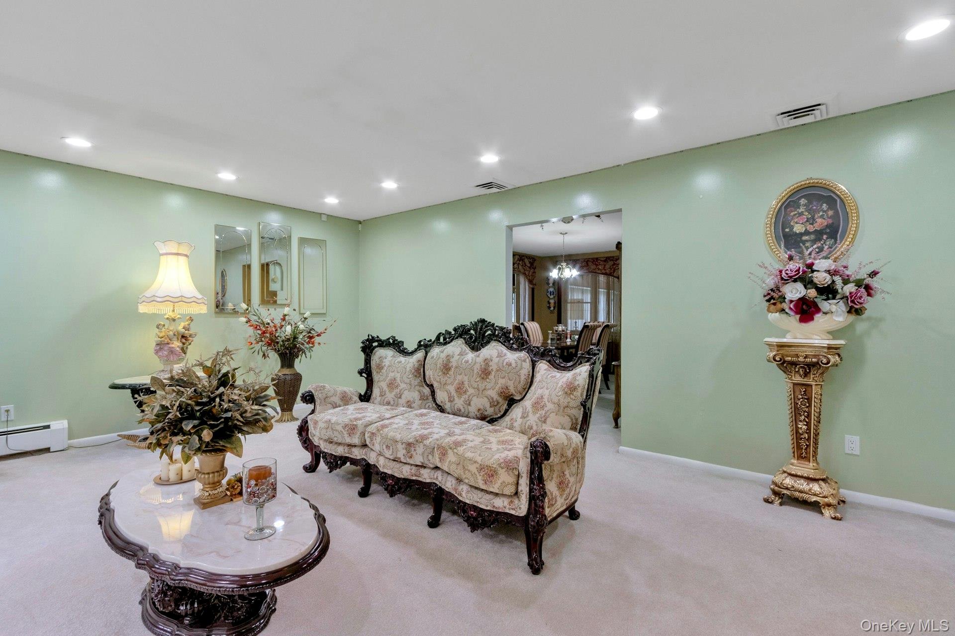 44 Greenridge Way Spring Valley, NY 10977 - Photo 7 of 46 a living room with furniture and flowers