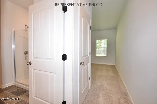 a spacious bathroom with a granite countertop sink a mirror and a