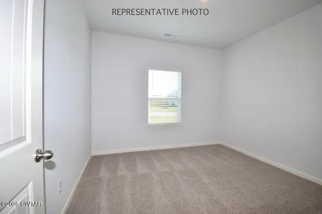a view of a hallway with a window