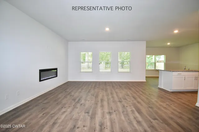 a view of an empty room and window