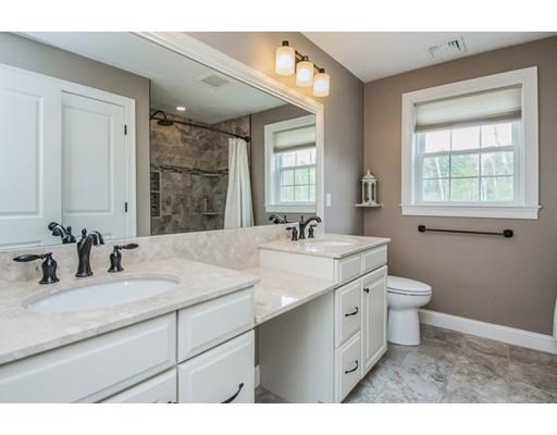 3 Hannon Road Billerica, MA 01862 - Photo 23 of 30 a bathroom with a double vanity sink toilet and a mirror
