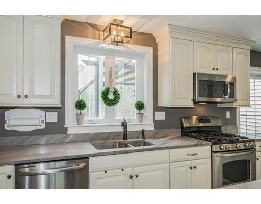 3 Hannon Road Billerica, MA 01862 - Photo 8 of 30 a kitchen with stainless steel appliances granite countertop a sink a stove and a microwave