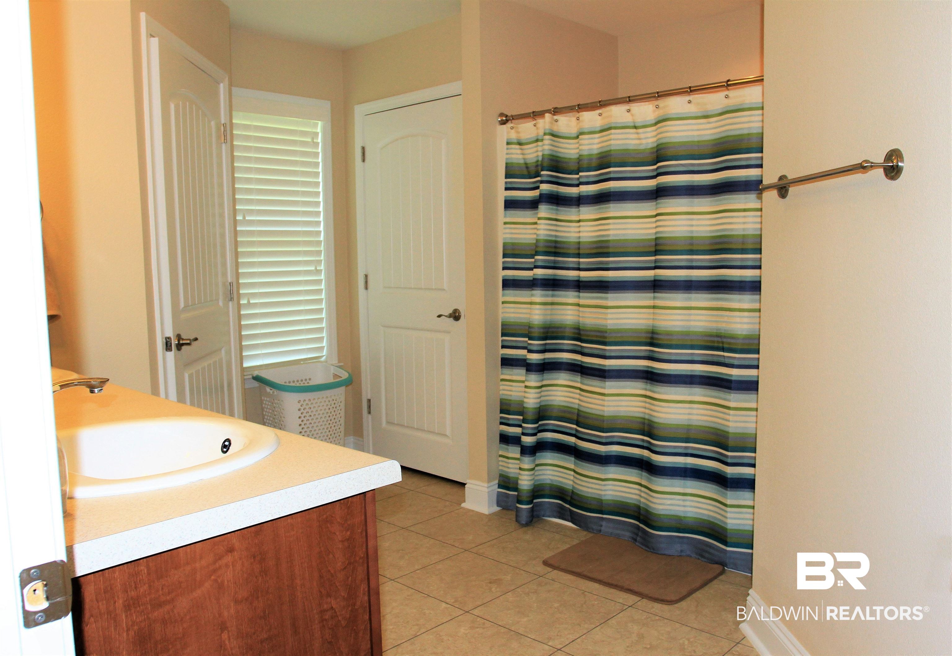 14620 Silvermere Drive Foley, AL 36535 - Photo 12 of 27 Linen & separate water closet. Tub-Shower combo.