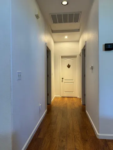 a bedroom with a bed and a table in it