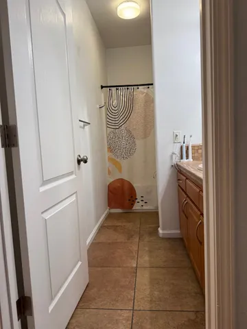 a view of a house with a garage and a fire pit