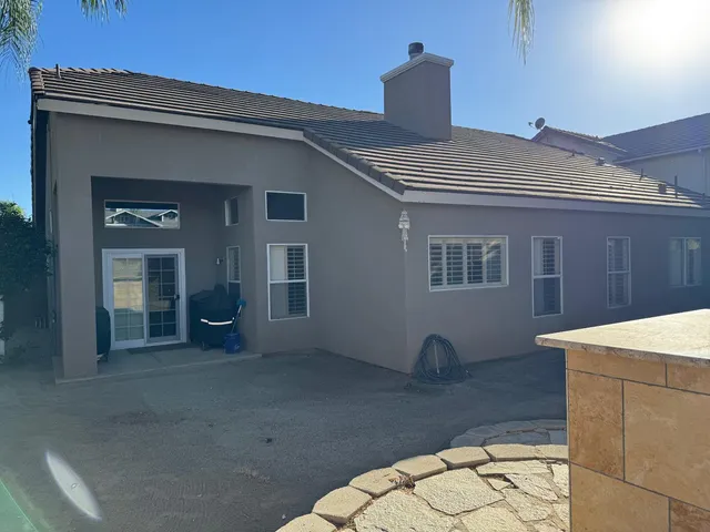 a view of a swimming pool and an outdoor space