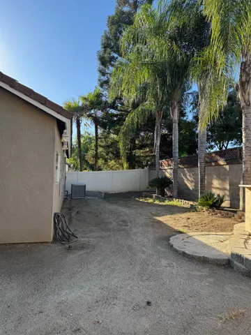 a flower plants with wooden fence