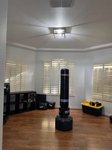 a room with pool table and a window