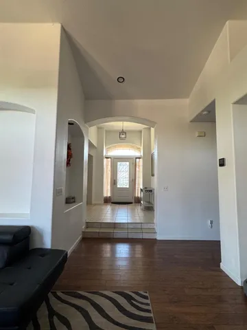 a living room with furniture fireplace and flat screen tv