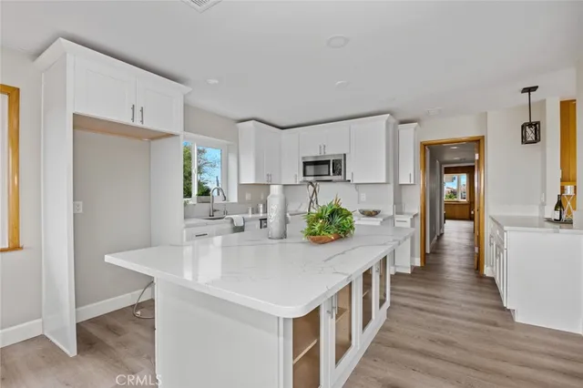 a kitchen with counter top space and refrigerator