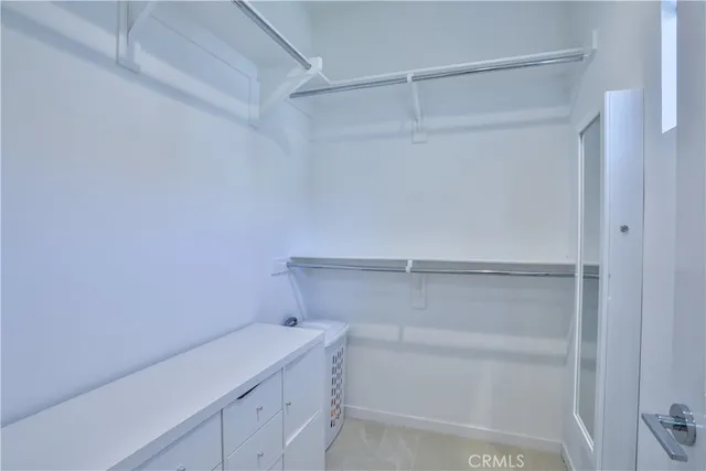a view of an empty walk in closet