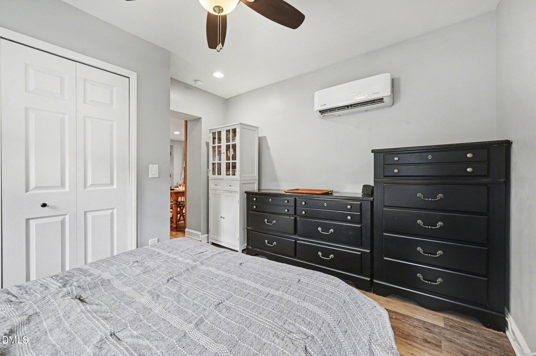 125 Barnhill Street Durham, NC 27707 - Photo 15 of 27 a bedroom with a bed and a dresser