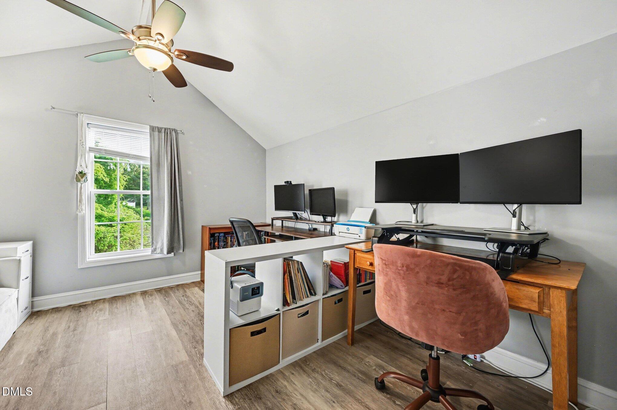 125 Barnhill Street Durham, NC 27707 - Photo 16 of 27 a view of a workspace with furniture and a window