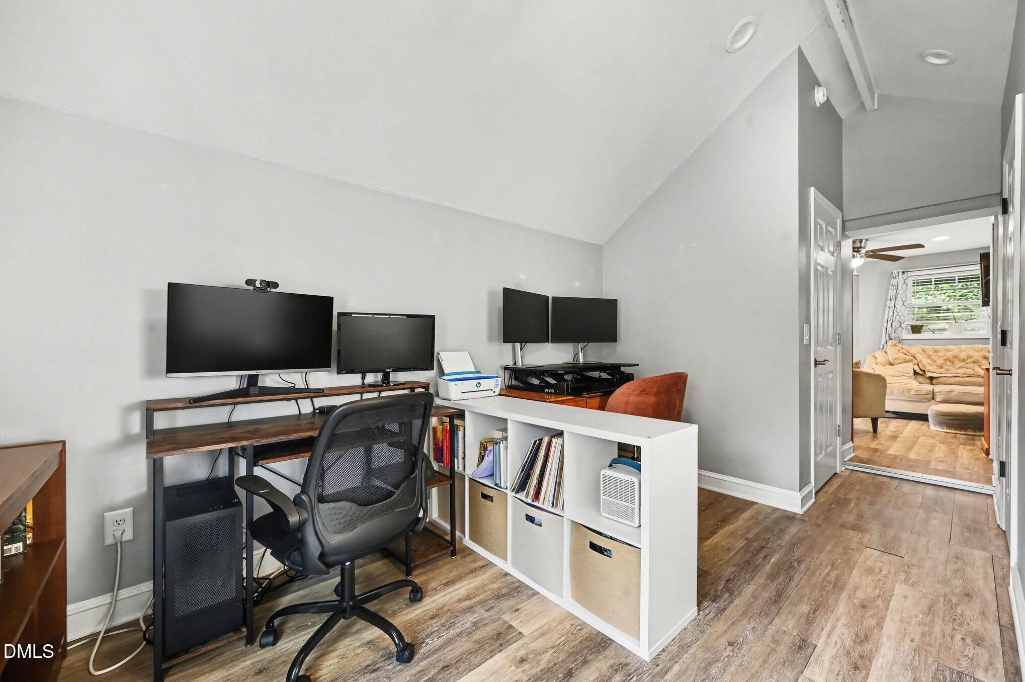 125 Barnhill Street Durham, NC 27707 - Photo 17 of 27 a view of a workspace with furniture and wooden floor