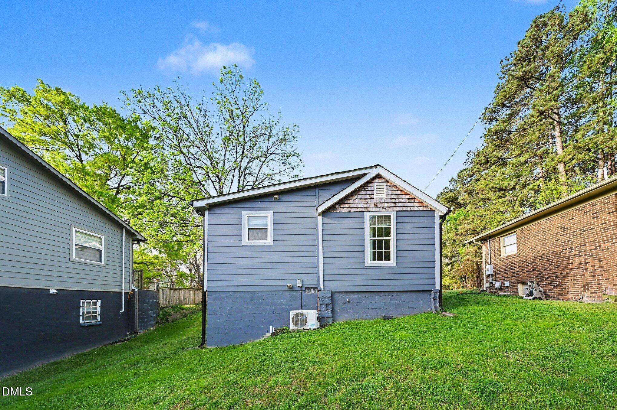 125 Barnhill Street Durham, NC 27707 - Photo 22 of 27 a front view of a house with a garden