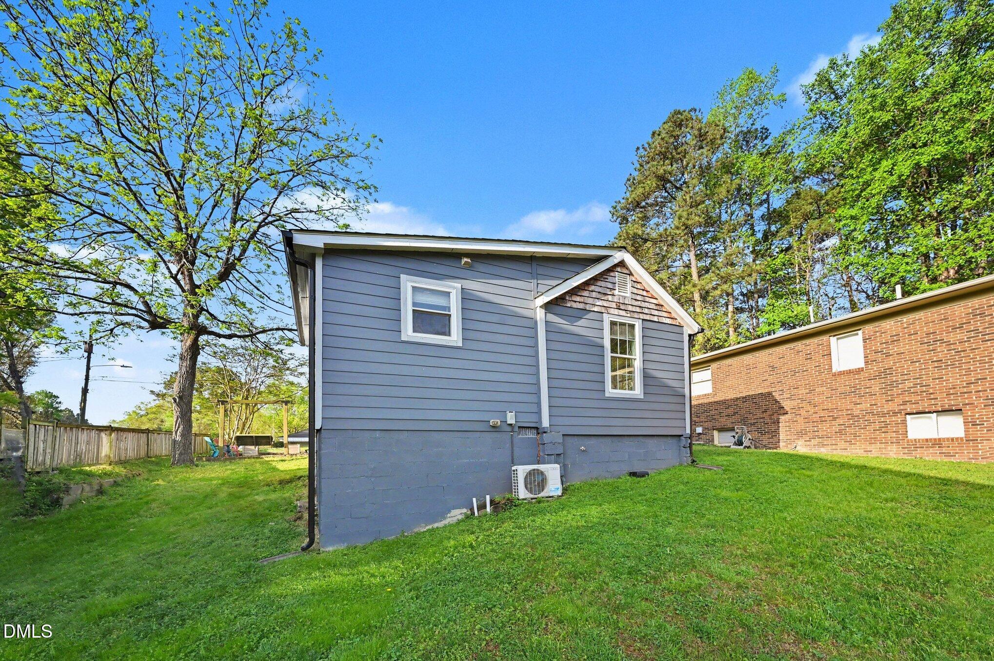 125 Barnhill Street Durham, NC 27707 - Photo 23 of 27 a backyard of a house with lots of green space