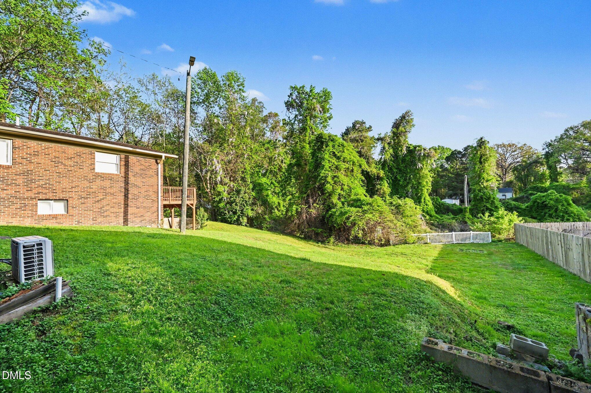 125 Barnhill Street Durham, NC 27707 - Photo 25 of 27 a view of a backyard with garden