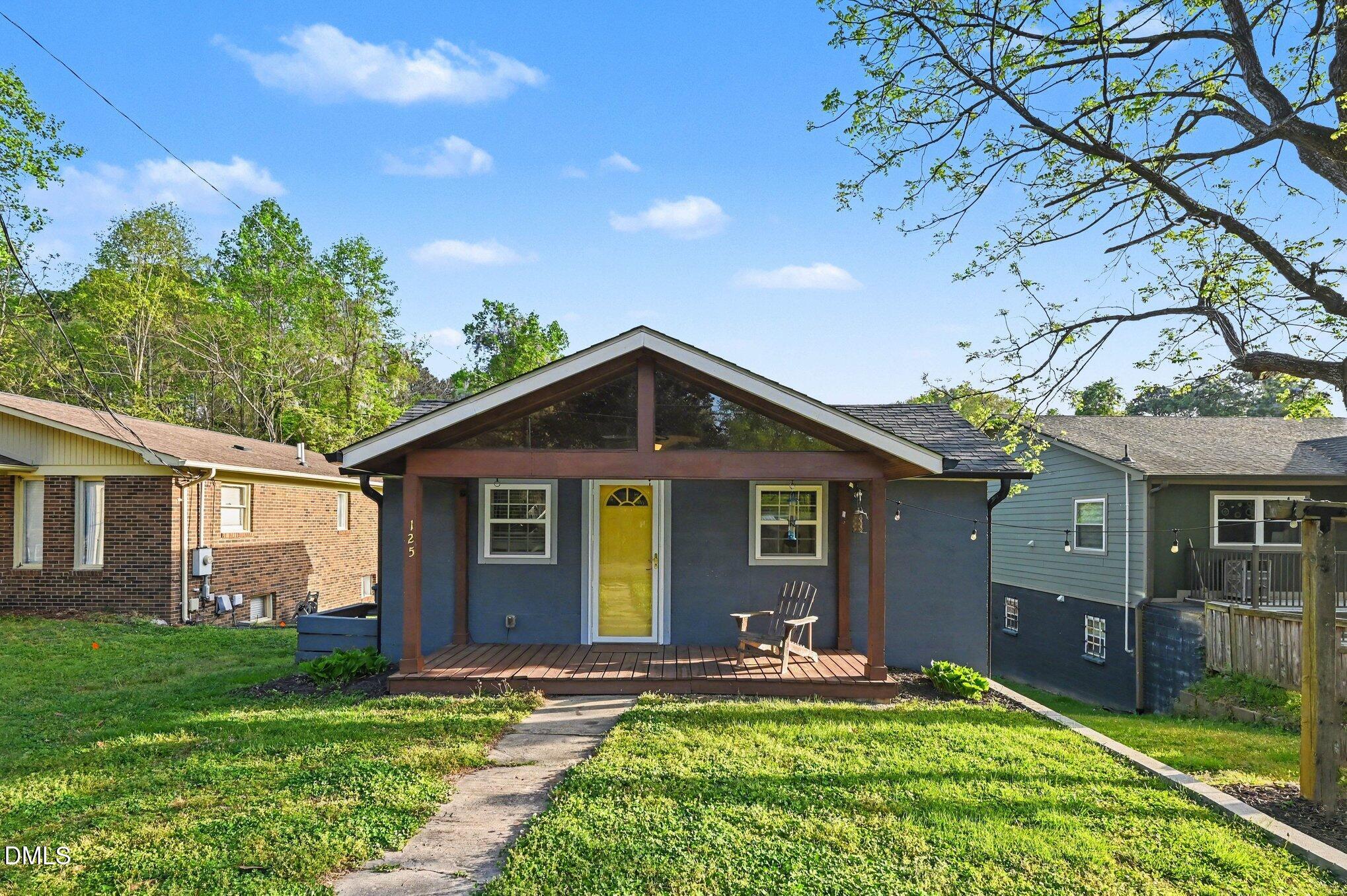 125 Barnhill Street Durham, NC 27707 - Photo 2 of 27 a front view of house with yard and green space