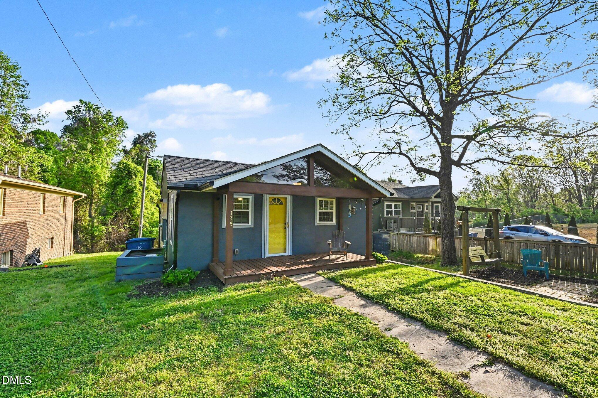 125 Barnhill Street Durham, NC 27707 - Photo 3 of 27 a front view of house with yard and green space