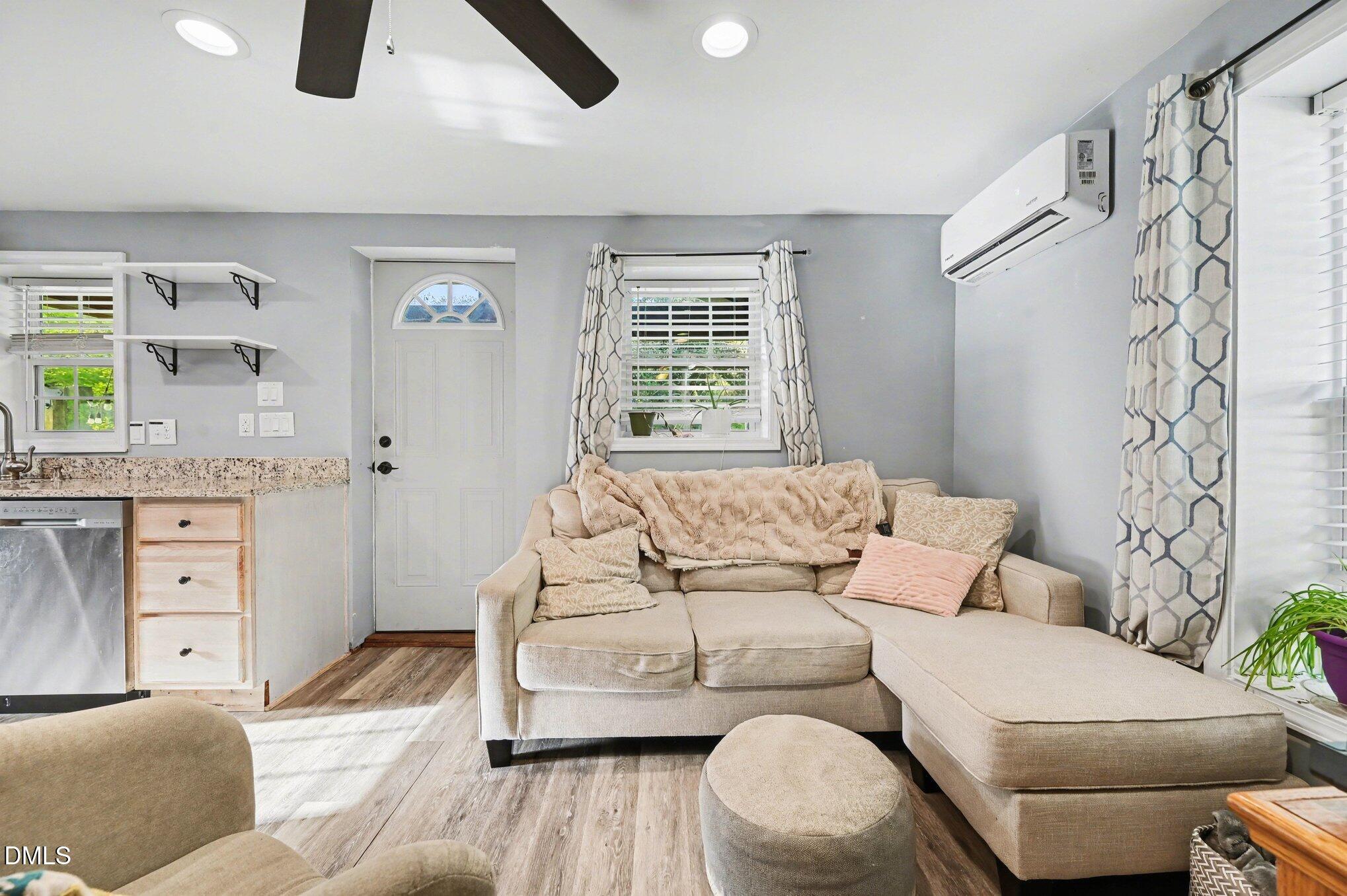 125 Barnhill Street Durham, NC 27707 - Photo 6 of 27 a living room with furniture and a window