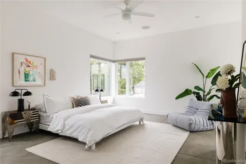 a bedroom with a bed and a couch