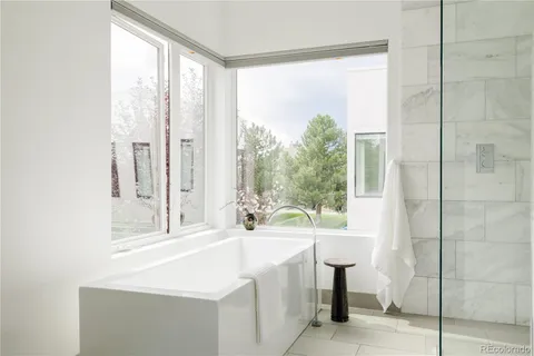 a bathroom with a bathtub and a sink