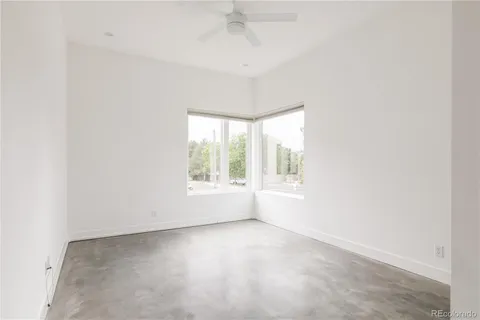 an empty room with a empty space and a window