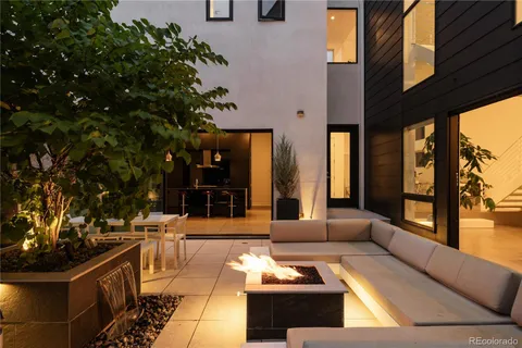a view of a patio with couches and potted plants