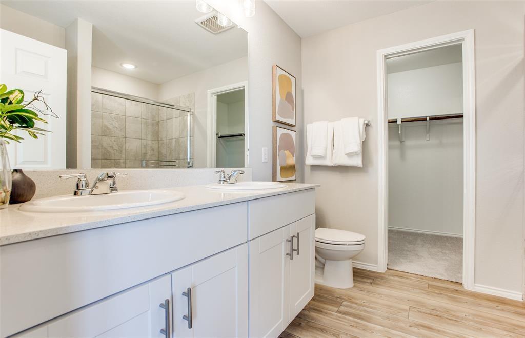 313 Hopson Street Van Alstyne, TX 75495 - Photo 15 of 16 a bathroom with a sink toilet and shower