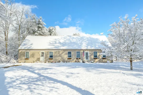 a view of houses with a snow