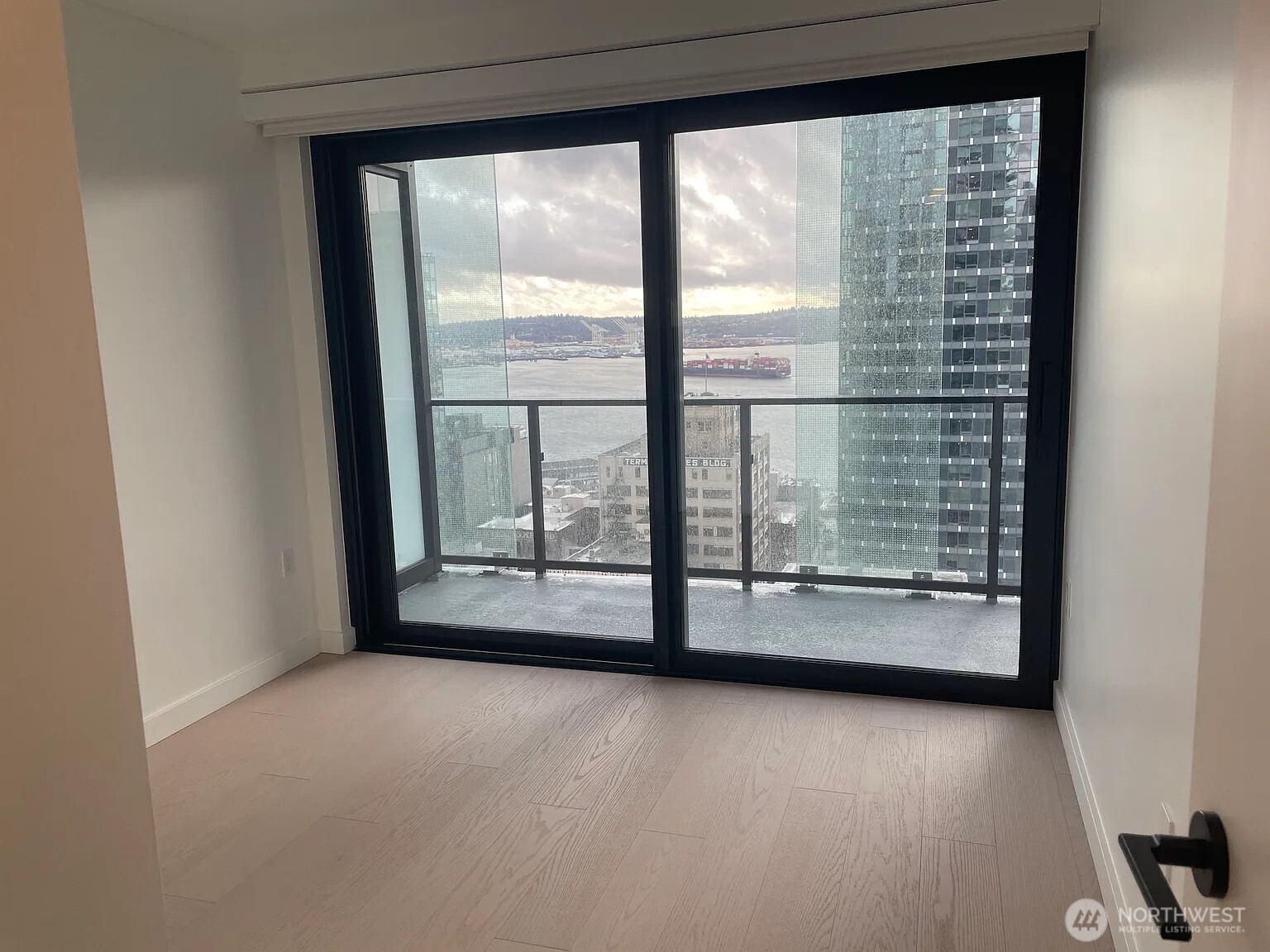 300 Virginia Street, Unit 2210 Seattle, WA 98101 - Photo 11 of 27 a view of empty room with floor to ceiling window