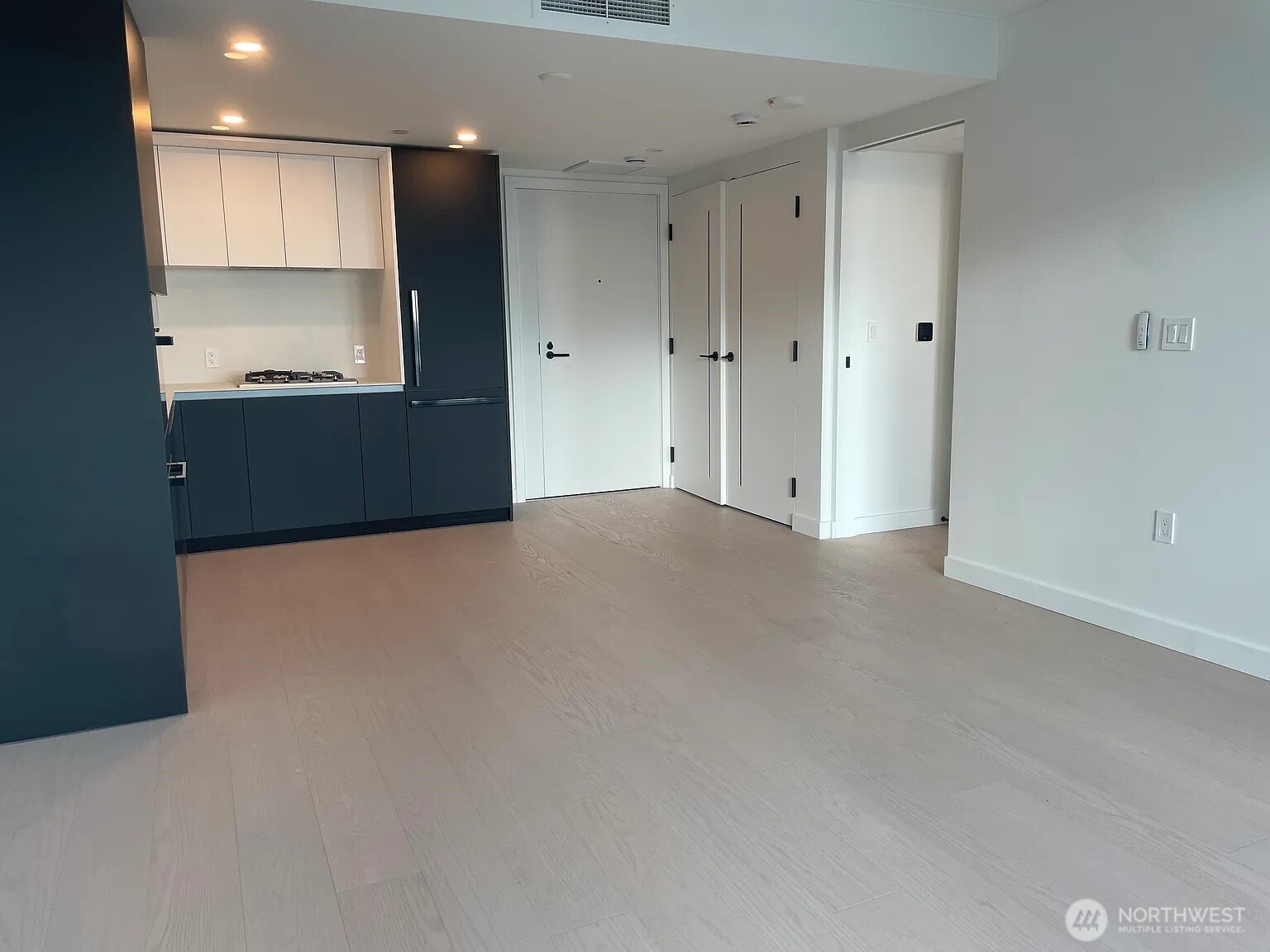 300 Virginia Street, Unit 2210 Seattle, WA 98101 - Photo 4 of 27 a view of an empty room with a kitchen