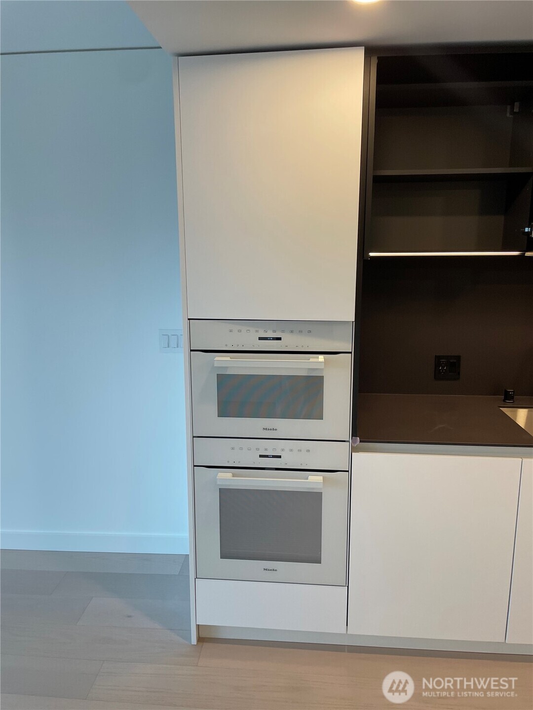 300 Virginia Street, Unit 2210 Seattle, WA 98101 - Photo 6 of 27 a utility room with washer and dryer