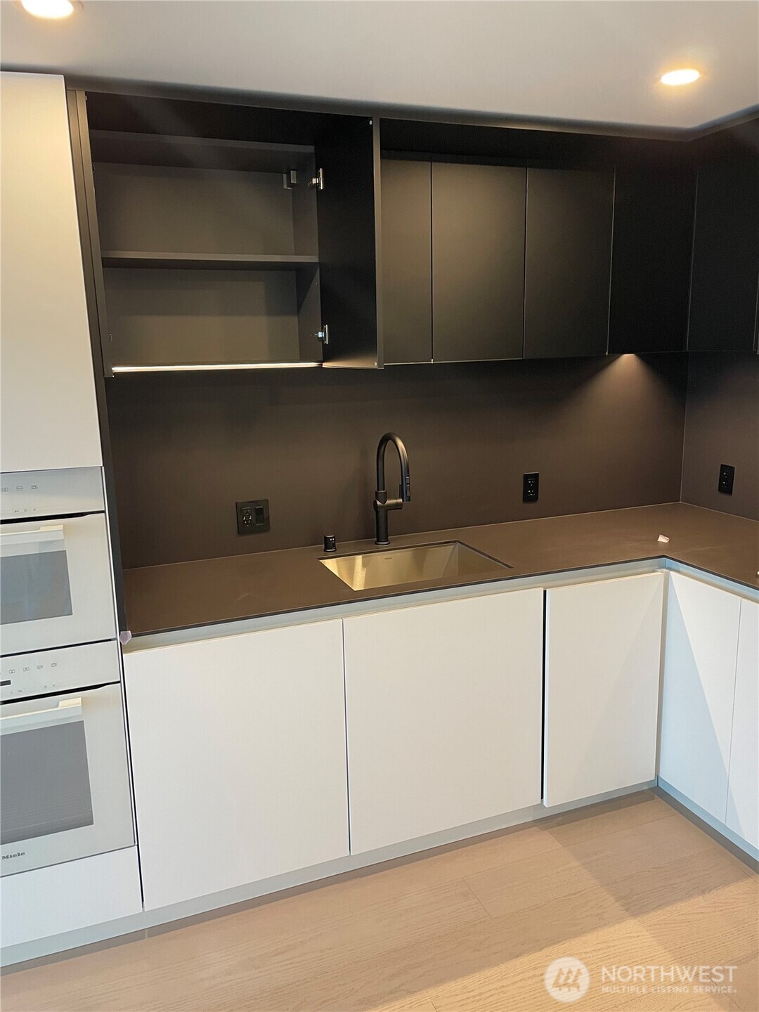 300 Virginia Street, Unit 2210 Seattle, WA 98101 - Photo 7 of 27 a kitchen with a sink and cabinets