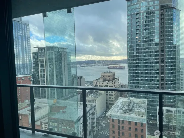 a bathroom with a glass shower door