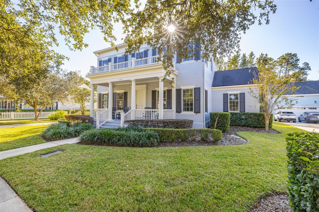 a front view of a house with swimming pool having outdoor seating