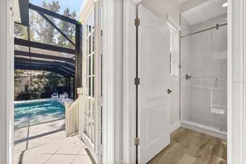 a view of a house with backyard and sitting area