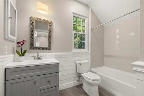 a bathroom with a sink a vanity and a mirror