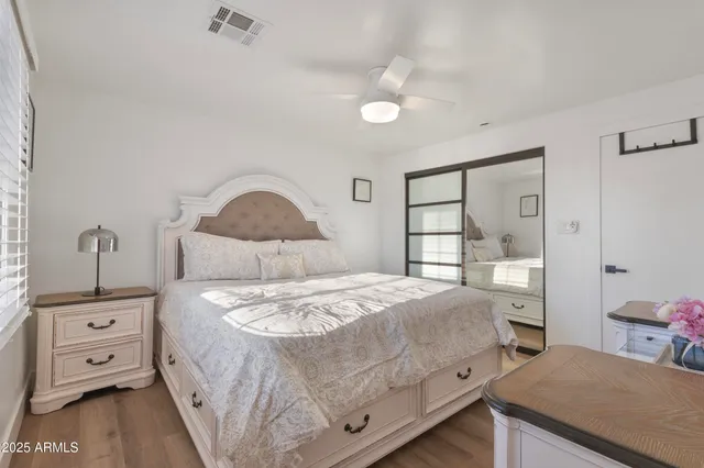 a bedroom with a bed and a dresser