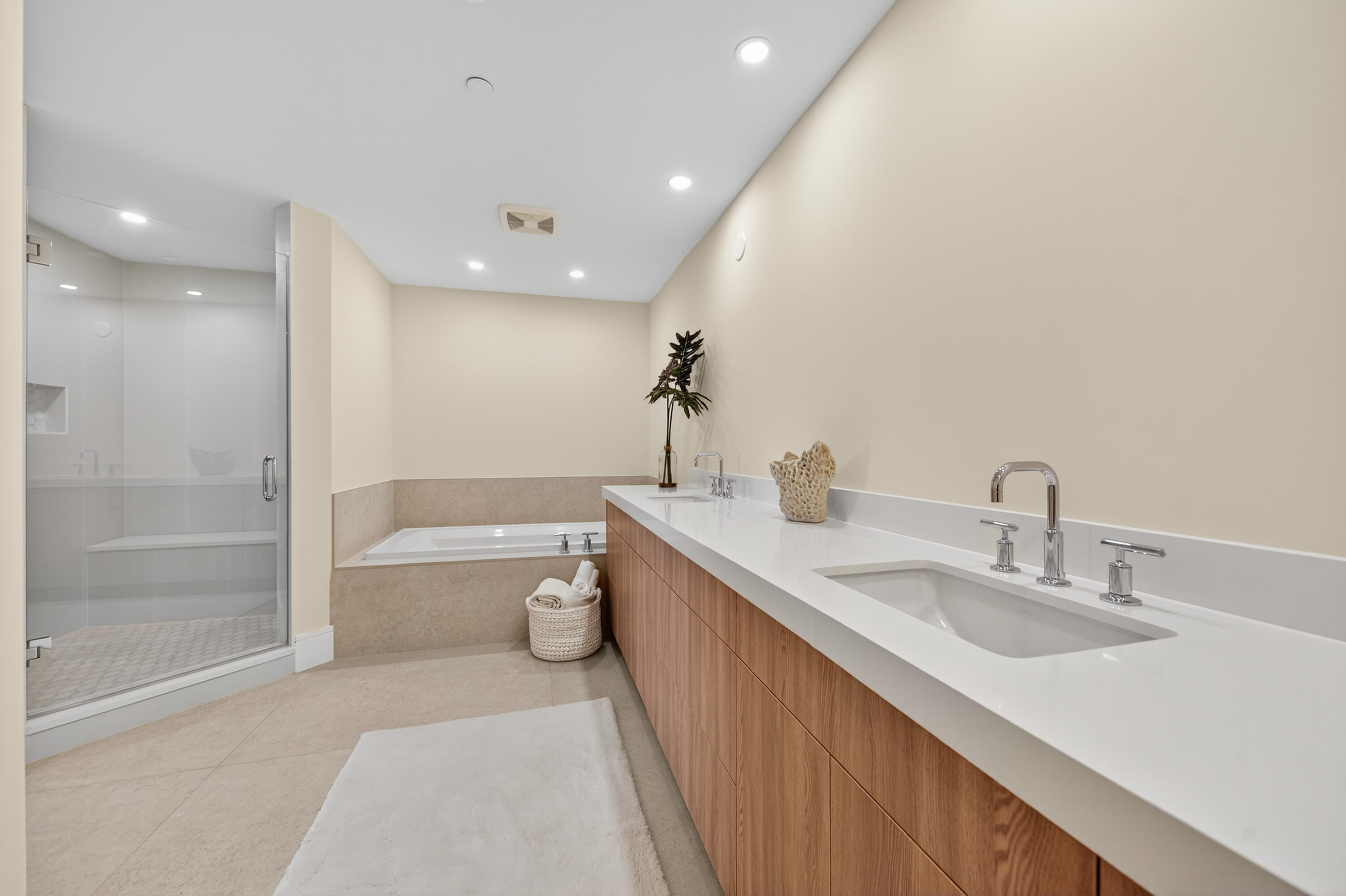 1 South Coastal Way, Unit 303 Jupiter, FL 33477 - Photo 12 of 61 a bathroom with a granite countertop sink a toilet a mirror and bathtub