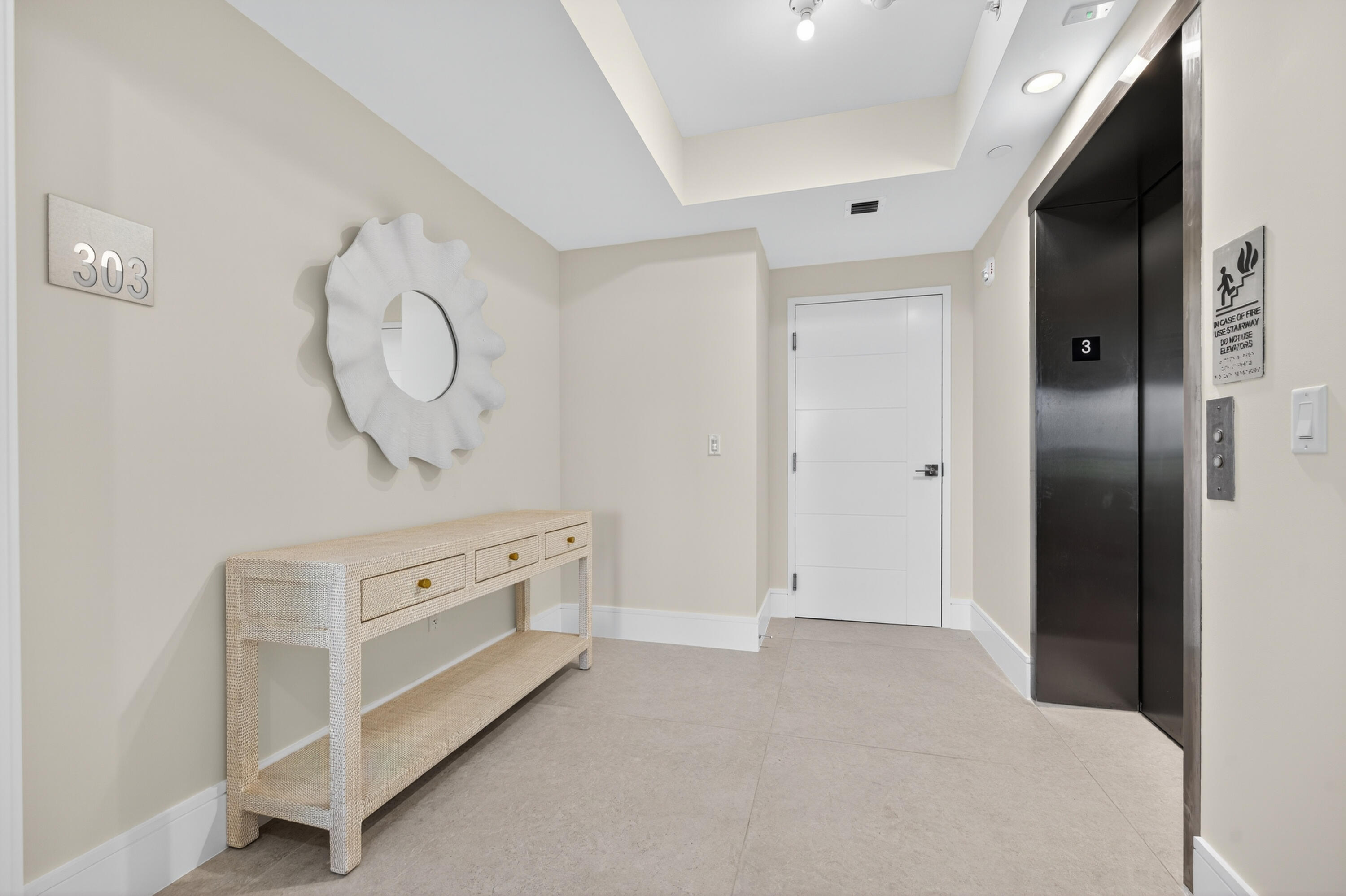 1 South Coastal Way, Unit 303 Jupiter, FL 33477 - Photo 2 of 61 a room with white cabinets and window