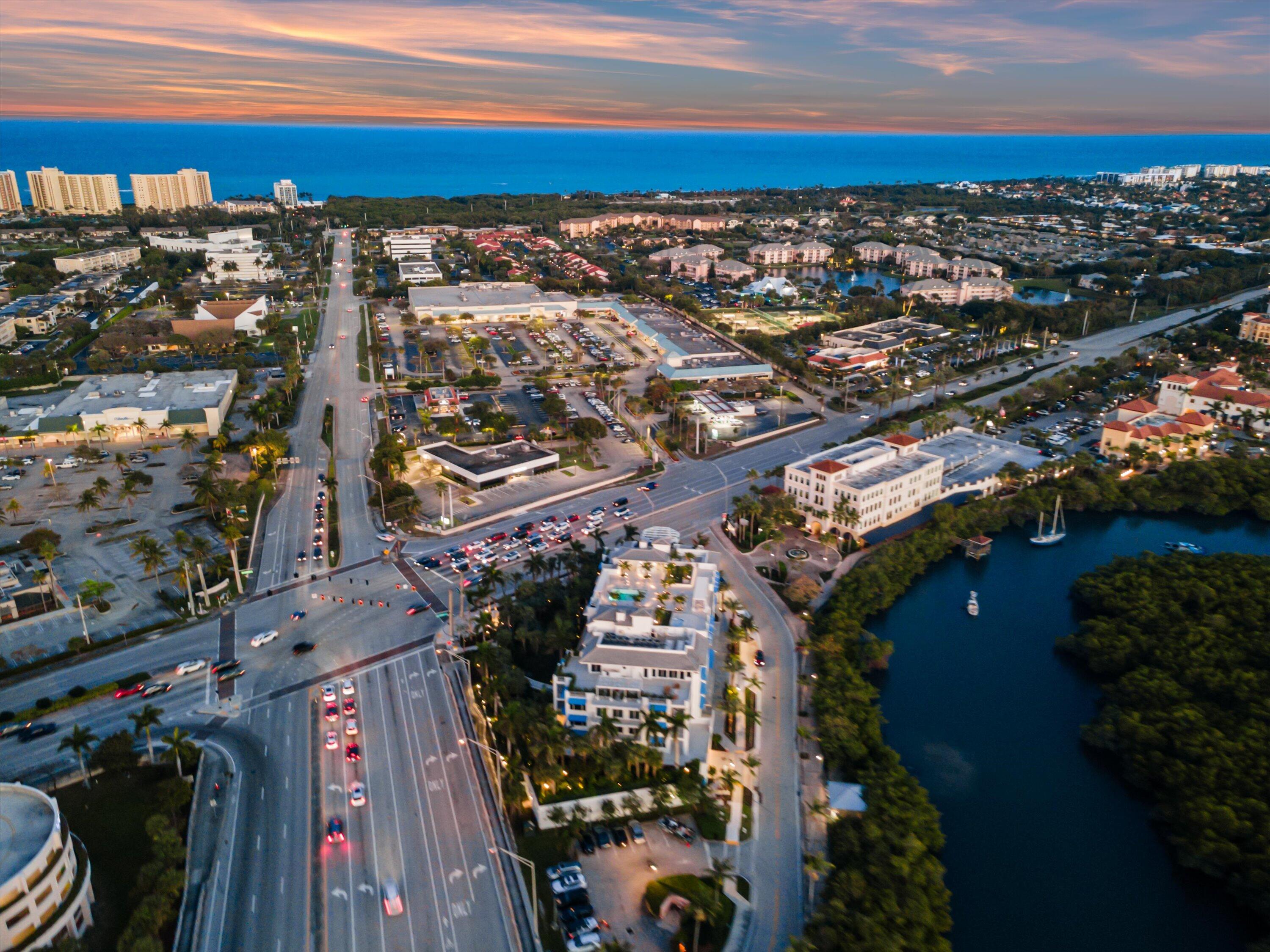 1 South Coastal Way, Unit 303 Jupiter, FL 33477 - Photo 42 of 61 a view of a city with lots of residential buildings and ocean view in back