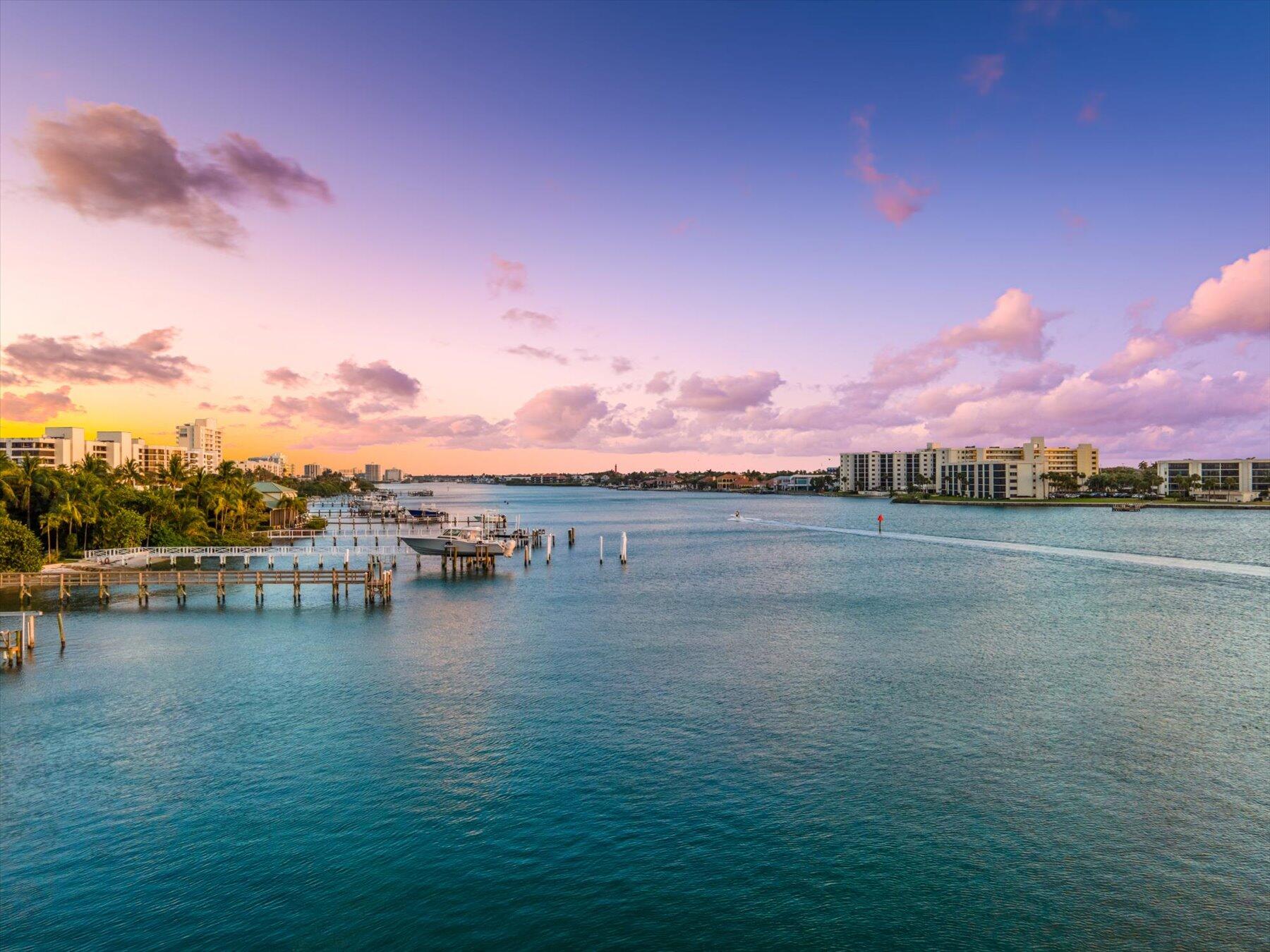 1 South Coastal Way, Unit 303 Jupiter, FL 33477 - Photo 51 of 61 a view of a lake with houses in the back
