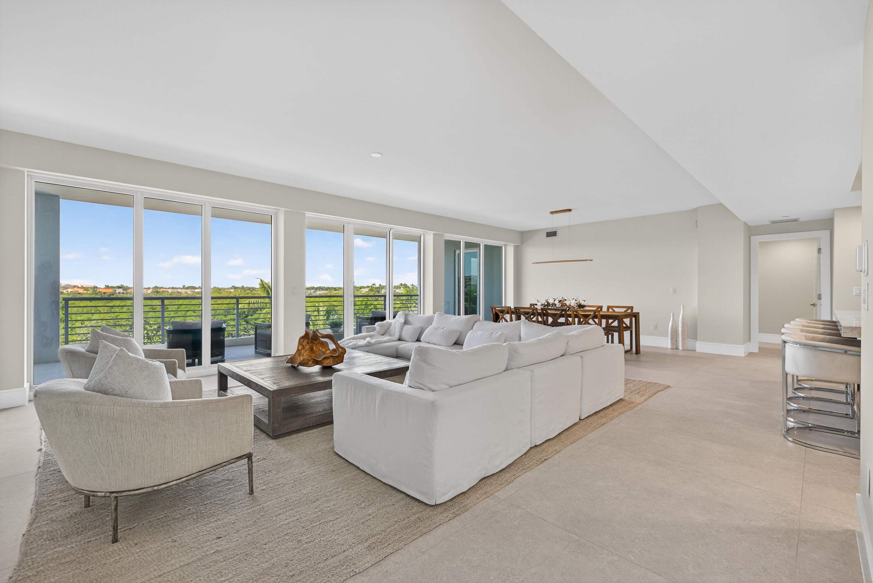 1 South Coastal Way, Unit 303 Jupiter, FL 33477 - Photo 6 of 61 a living room with furniture and a large window