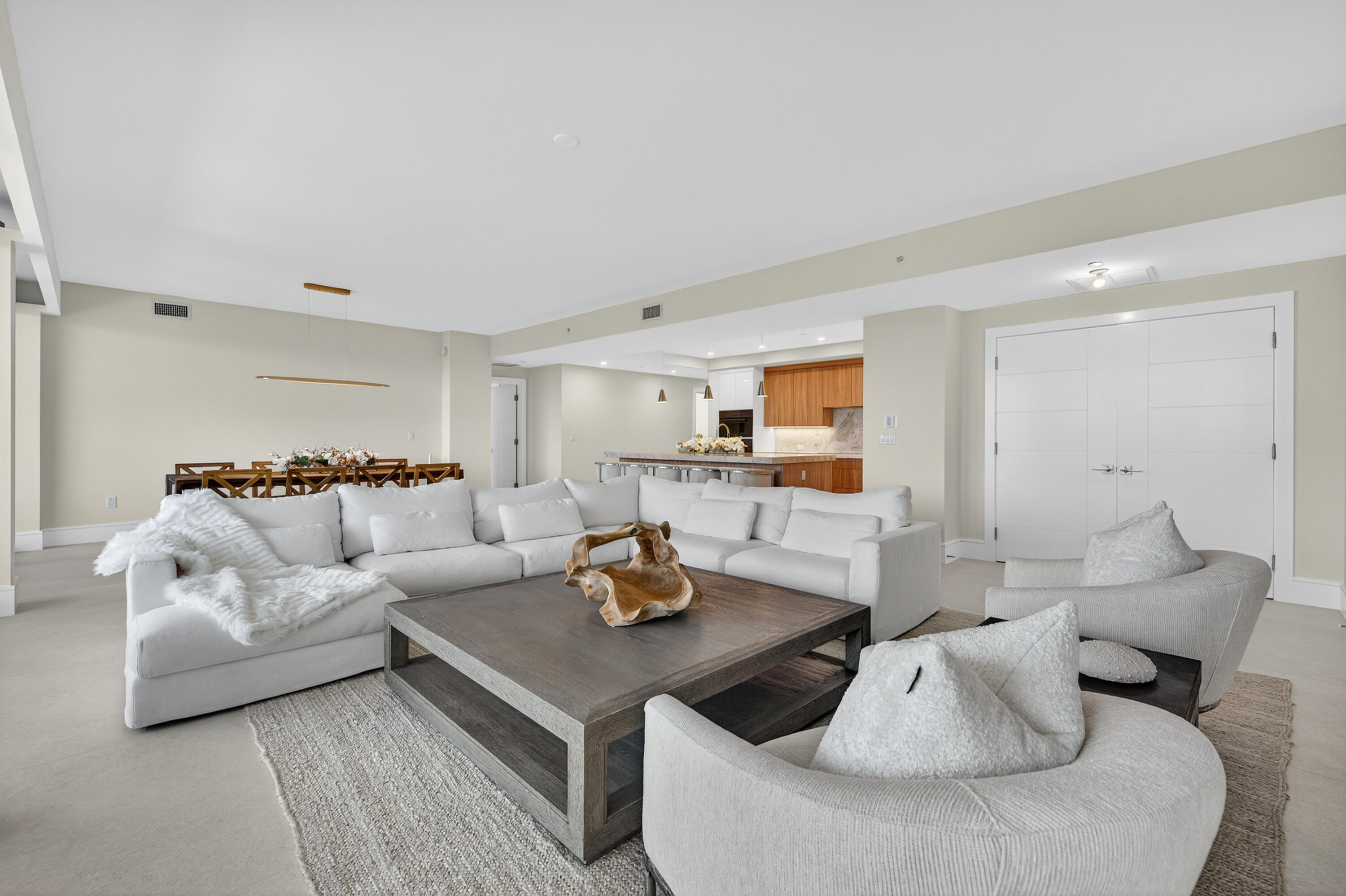 1 South Coastal Way, Unit 303 Jupiter, FL 33477 - Photo 8 of 61 a living room with furniture and view of kitchen