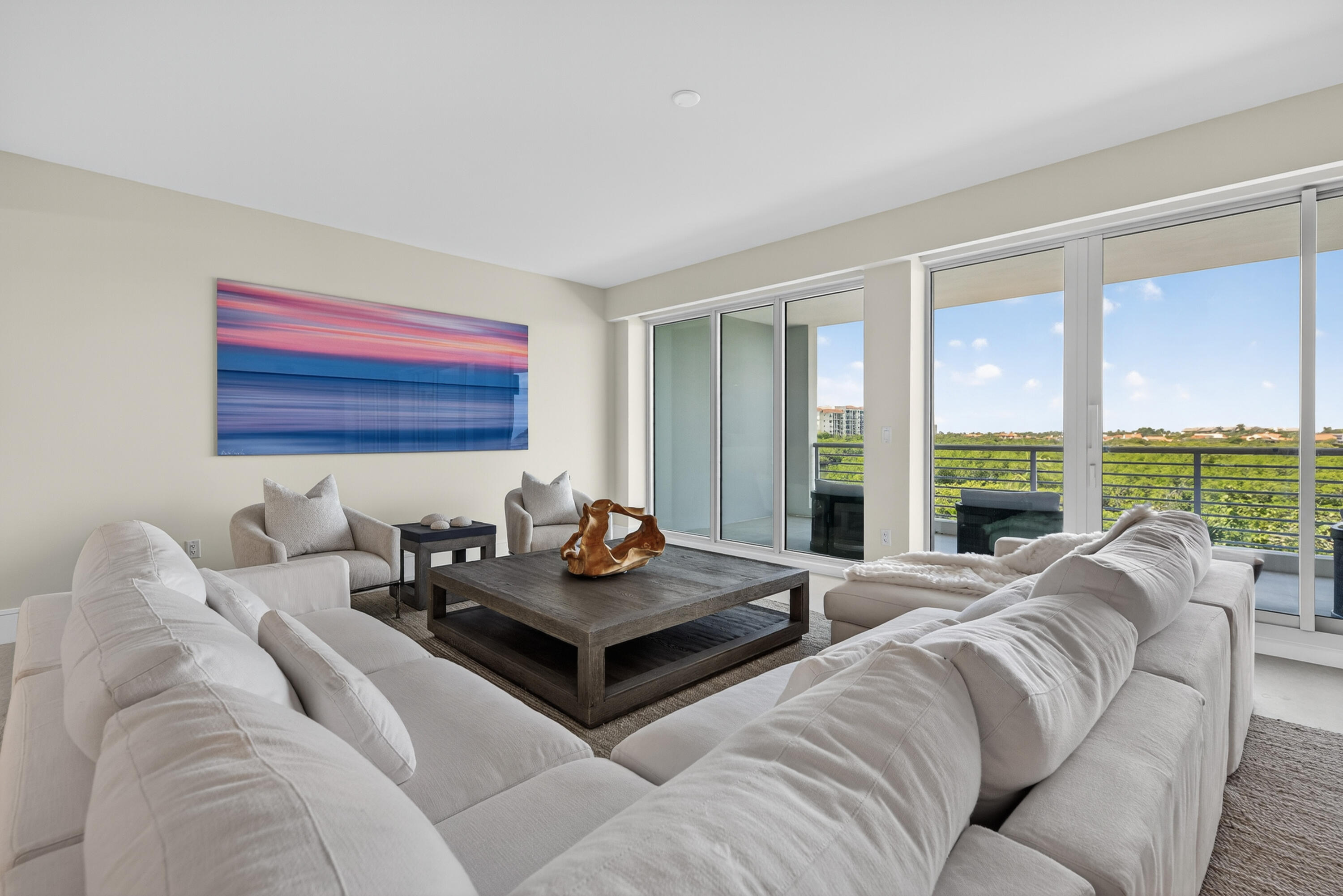 1 South Coastal Way, Unit 303 Jupiter, FL 33477 - Photo 9 of 61 a living room with furniture and a large window