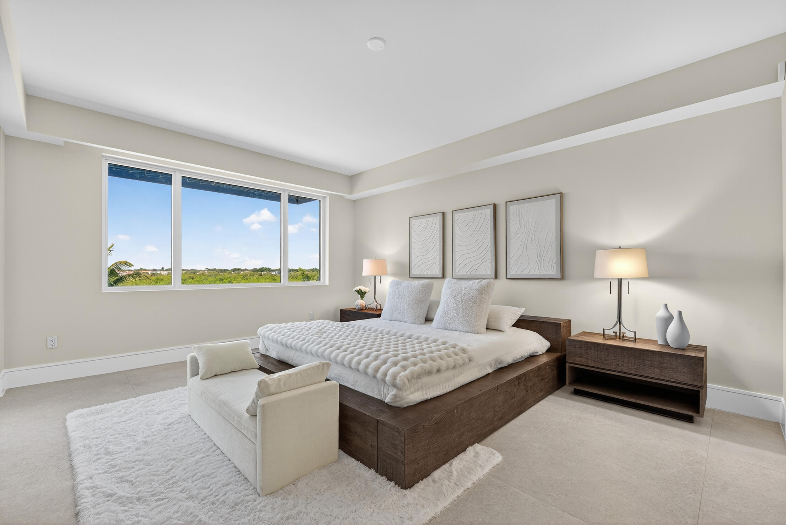 1 South Coastal Way, Unit 303 Jupiter, FL 33477 - Photo 10 of 61 a bedroom with a bed lamp and a window