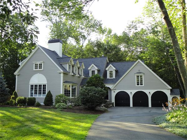 294 Pope Road Acton, MA 01720 - Photo 1 of 30 a view of a white house with a yard and large trees