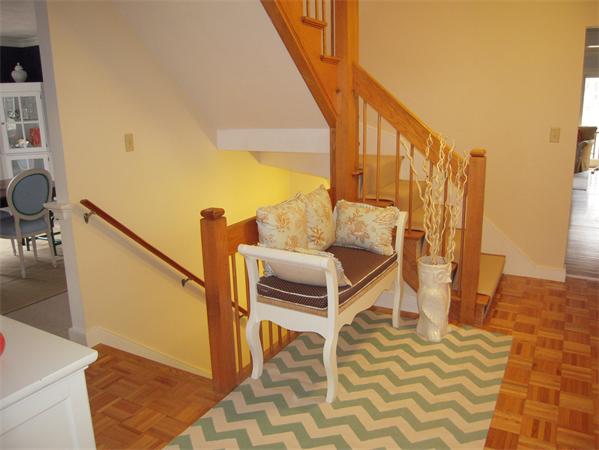 294 Pope Road Acton, MA 01720 - Photo 4 of 30 a view of entryway dining room and hall with wooden floor